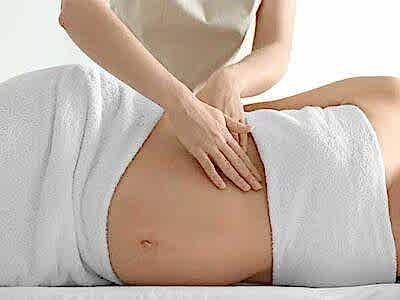 woman receiving a pregnancy massage